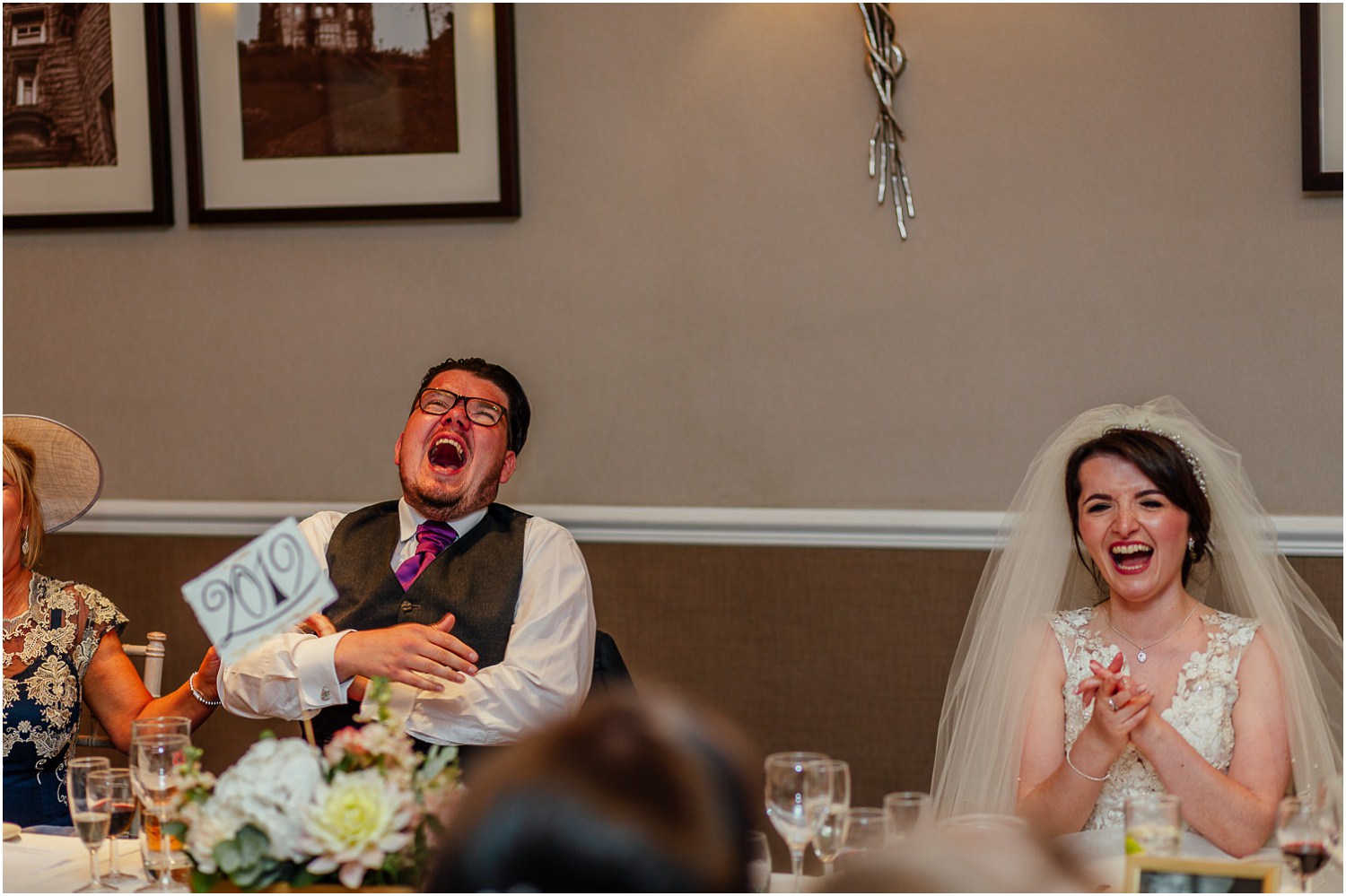 bride and brother laughing at speeches at sherbrooke castle hotel