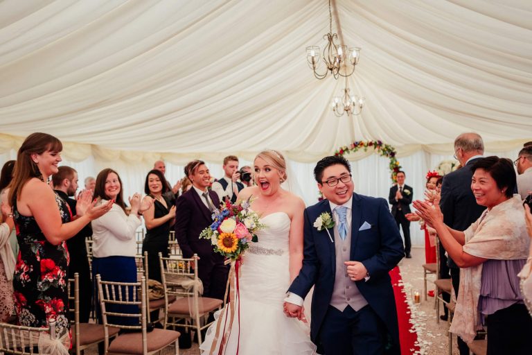 bride groom walking down aisle just married super happy cornhill castle scotland