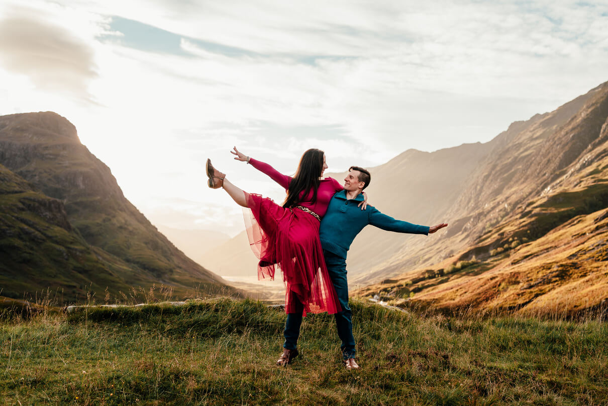 a couple dance on a mountaintop in glencoe scotland